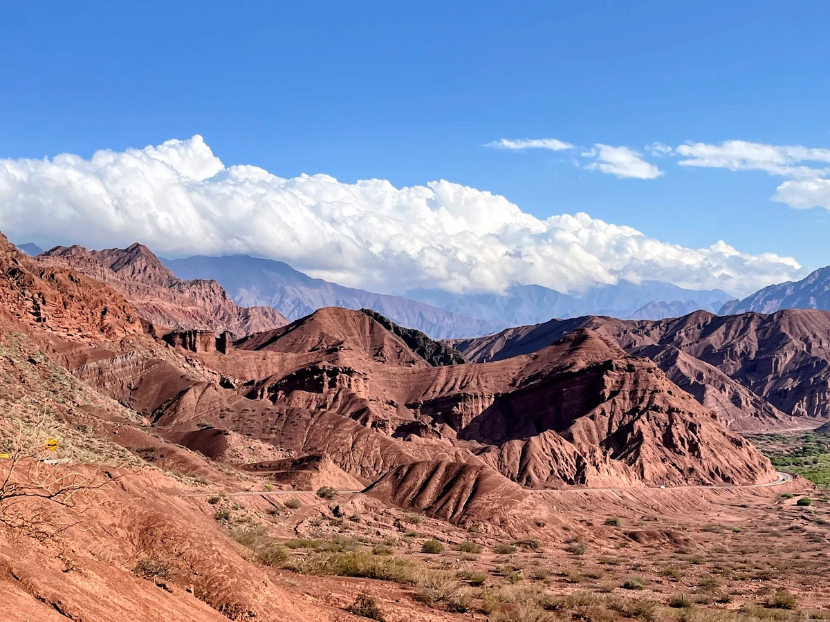 Red mountains under summer clouds